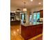 Open-concept kitchen and living area with hardwood floors and abundant natural light at 4020 Toulon Ln, Cumming, GA 30040