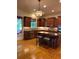 Updated kitchen with wood cabinets, stainless steel appliances, and a central island at 4020 Toulon Ln, Cumming, GA 30040