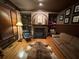 Elegant living room with a cozy fireplace, built-in bookshelves, and a comfortable seating area at 4020 Toulon Ln, Cumming, GA 30040