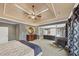 Comfortable main bedroom features tray ceilings, neutral color palette, and an attached sitting area for relaxation at 4020 Toulon Ln, Cumming, GA 30040