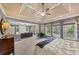 Expansive main bedroom boasts tray ceilings, recessed lights, sitting area, and lots of natural light at 4020 Toulon Ln, Cumming, GA 30040