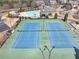 Aerial view of community tennis courts near the pool and clubhouse at 4020 Toulon Ln, Cumming, GA 30040