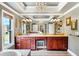 The main bathroom features double sinks with wood cabinets, a chandelier, and natural light from a window at 4020 Toulon Ln, Cumming, GA 30040