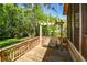 Outdoor deck with wood railings, swing and screened-in porch at 4400 Huntington Cir, Dunwoody, GA 30338