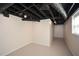 Unfinished basement featuring concrete floor, exposed ceiling at 4400 Huntington Cir, Dunwoody, GA 30338