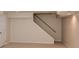 Basement featuring a staircase, neutral carpet and white walls at 4400 Huntington Cir, Dunwoody, GA 30338