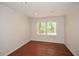 Bright room featuring hardwood floors, crown molding, and a window with natural light at 4400 Huntington Cir, Dunwoody, GA 30338
