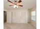 Bedroom featuring closets, windows, and a ceiling fan at 4400 Huntington Cir, Dunwoody, GA 30338