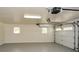 Single-car garage features bright lighting and a clean, finished floor at 4400 Huntington Cir, Dunwoody, GA 30338