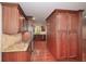 Elegant kitchen area featuring granite countertops and stylish wood cabinets at 4400 Huntington Cir, Dunwoody, GA 30338