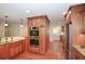Stylish kitchen with stainless steel appliances, granite counters, and wood cabinetry at 4400 Huntington Cir, Dunwoody, GA 30338