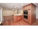 Modern kitchen featuring an island, stainless steel appliances and wood cabinets at 4400 Huntington Cir, Dunwoody, GA 30338