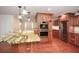 Well-equipped kitchen with granite counters, stainless steel appliances, and hardwood floors at 4400 Huntington Cir, Dunwoody, GA 30338