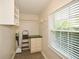 Functional walk-in closet with built-in shelves and storage space, complemented by a window at 4400 Huntington Cir, Dunwoody, GA 30338