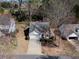 An aerial view of the residence showing the driveway, landscaping, and proximity to other neighborhood homes at 509 Carrington Ct, Canton, GA 30115