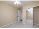 Neutral bedroom with mirrored closet doors and ample natural light at 509 Carrington Ct, Canton, GA 30115