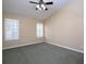Spacious bedroom with neutral carpet, plantation shutters, and ample natural light at 509 Carrington Ct, Canton, GA 30115