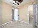 Carpeted bedroom with ceiling fan and closet with open door to another room at 509 Carrington Ct, Canton, GA 30115
