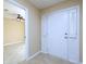Inviting foyer with tile floors, a white front door, and an open view into the living space at 509 Carrington Ct, Canton, GA 30115