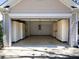 Spacious garage with ample built-in storage cabinets and room for parking at 509 Carrington Ct, Canton, GA 30115