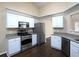Modern kitchen with stainless steel appliances, granite countertops, and ample cabinet space at 509 Carrington Ct, Canton, GA 30115