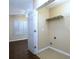 Convenient laundry room area with shelving and connections for washer and dryer at 509 Carrington Ct, Canton, GA 30115