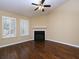 Spacious living room with hardwood floors, a fireplace, and a vaulted ceiling at 509 Carrington Ct, Canton, GA 30115