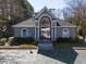 Gated entrance to the community pool area, featuring a decorative archway and manicured landscaping at 509 Carrington Ct, Canton, GA 30115