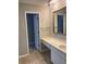 Bright bathroom with a vanity, sink, and mirror at 165 Woodhaven Way, Alpharetta, GA 30009