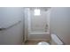 Bathroom featuring toilet, shower/tub, and tiled walls at 165 Woodhaven Way, Alpharetta, GA 30009