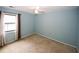Cozy bedroom featuring a ceiling fan and a large window with natural light at 165 Woodhaven Way, Alpharetta, GA 30009