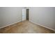 Bedroom with neutral walls and carpet, featuring an open doorway at 165 Woodhaven Way, Alpharetta, GA 30009