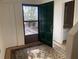 Welcoming entryway with a decorative rug, green front door, and a glimpse into the interior at 165 Woodhaven Way, Alpharetta, GA 30009