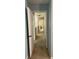 A bright hallway leading to multiple rooms with carpeted flooring at 165 Woodhaven Way, Alpharetta, GA 30009
