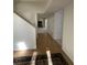 Spacious entry flowing into living room with hardwood floors and a fireplace, creating a cozy and inviting atmosphere at 165 Woodhaven Way, Alpharetta, GA 30009