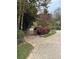 Backyard view with fenced area, basketball hoop, and lush landscaping at 3200 Farmington, Vinings, GA 30339