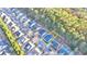 Aerial view of a home with a driveway and backyard near a wooded area in a suburban neighborhood at 3775 Pine Village Pl, Loganville, GA 30052