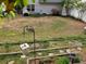 Spacious backyard with a small garden area, grill, patio furniture, and a variety of mature trees at 3775 Pine Village Pl, Loganville, GA 30052