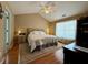 Cozy bedroom featuring a plush bed, neutral tones, and a bright window at 3775 Pine Village Pl, Loganville, GA 30052