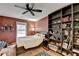 Bedroom featuring a ceiling fan, a built-in bookshelf and decor at 3775 Pine Village Pl, Loganville, GA 30052