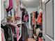 Walk-in closet with organized shelving and hanging racks, perfect for storage at 3775 Pine Village Pl, Loganville, GA 30052