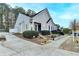 Charming single-Gathering home featuring well-maintained landscaping, symmetrical design, and inviting curb appeal at 3775 Pine Village Pl, Loganville, GA 30052