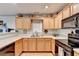Functional kitchen with ample cabinet space, modern appliances, and light countertops at 3775 Pine Village Pl, Loganville, GA 30052