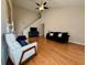 Bright and airy living room with fireplace, high ceilings, and hardwood floors at 3775 Pine Village Pl, Loganville, GA 30052