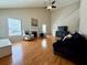 Open living room features high ceilings, fireplace, and hardwood floors at 3775 Pine Village Pl, Loganville, GA 30052