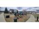 Community playground with swings, slides, benches, and trash can at 3775 Pine Village Pl, Loganville, GA 30052