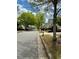 Street view of suburban homes with lawns and mature shade trees at 3775 Pine Village Pl, Loganville, GA 30052
