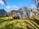 Charming backyard with a small deck and grassy space, perfect for outdoor activities with a blue siding home at 4665 Garden Hills Dr, Stone Mountain, GA 30083