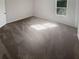 Bedroom with neutral walls and new carpet at 4665 Garden Hills Dr, Stone Mountain, GA 30083