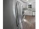 Modern kitchen with white cabinets, stainless steel appliances, and granite countertops at 4665 Garden Hills Dr, Stone Mountain, GA 30083